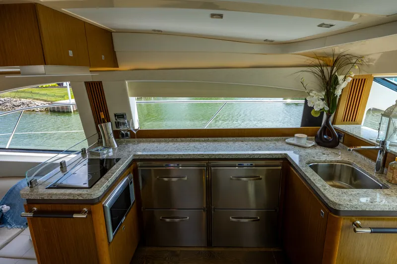 Slide: The Image of Luxurious kitchen interior of 2017 Sea Ray Fly 510 yacht with modern amenities. - 33