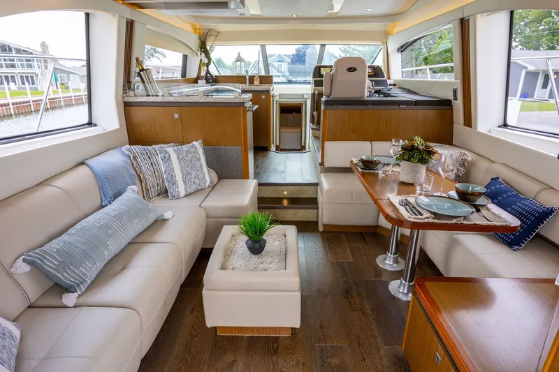 Slide: The Image of Luxurious interior of 2017 Sea Ray Fly 510 yacht with elegant seating and dining area. - 24