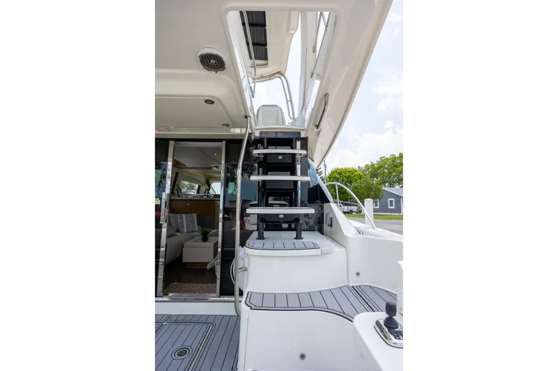 Slide: The Image of Staircase on 2017 Sea Ray Fly 510 yacht leading to upper deck, with interior view. - 6