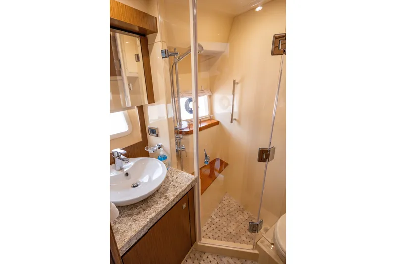 Slide: The Image of Luxurious bathroom in 2017 Sea Ray Fly 510 yacht with modern fixtures and glass shower. - 52