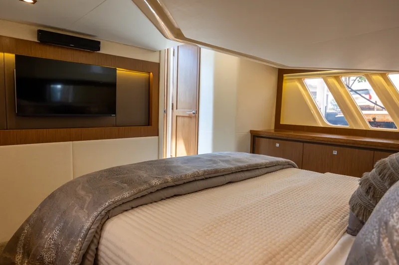 Slide: The Image of Luxurious bedroom interior of 2017 Sea Ray Fly 510 yacht with TV and modern decor. - 41