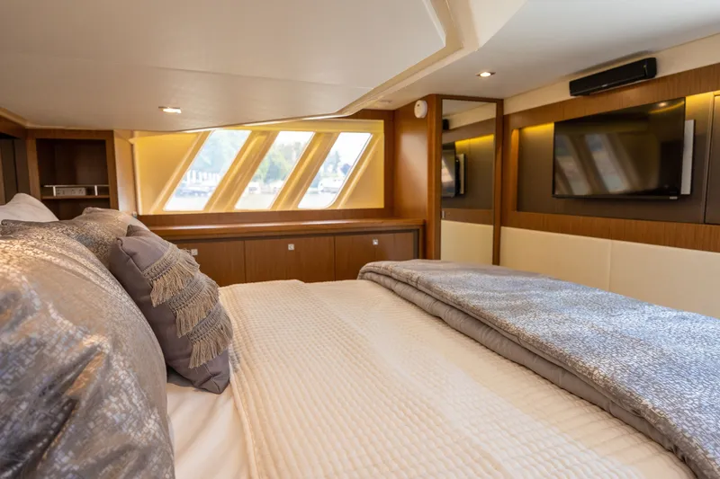 Slide: The Image of Luxurious bedroom interior of 2017 Sea Ray Fly 510 yacht with elegant bedding and windows. - 42