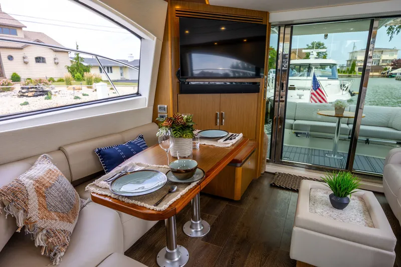 Slide: The Image of Luxurious interior of 2017 Sea Ray Fly 510 yacht with elegant dining area. - 28
