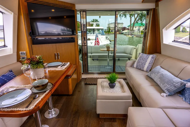 Slide: The Image of Luxurious interior of 2017 Sea Ray Fly 510 yacht with elegant dining and seating area. - 25