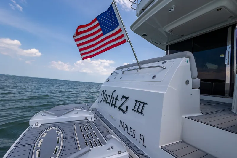 Slide: The Image of 2017 Sea Ray Fly 510 yacht with American flag, Naples, FL. - 21