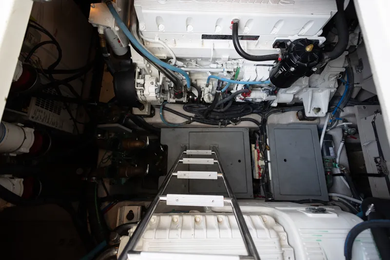 Slide: The Image of Engine room of 2017 Sea Ray Fly 510 yacht, featuring mechanical components and wiring. - 55