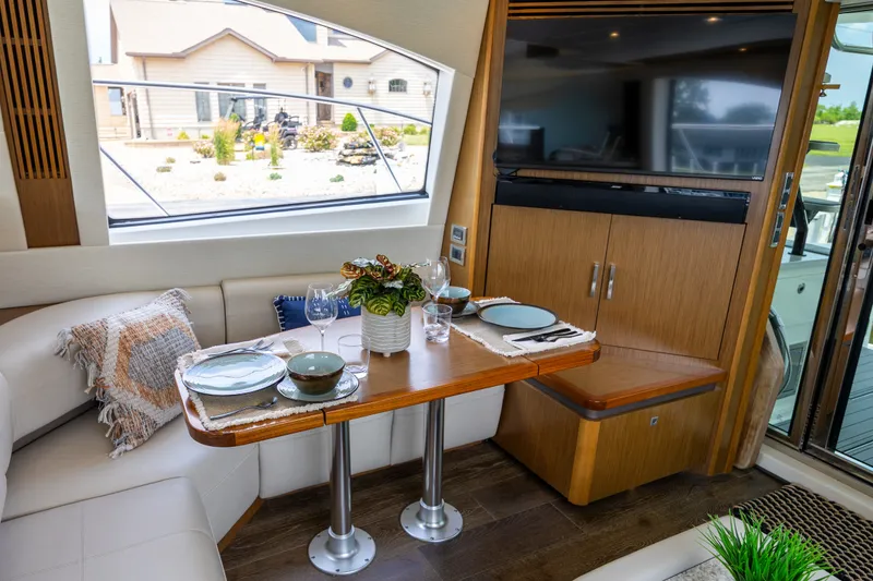 Slide: The Image of Luxurious interior of 2017 Sea Ray Fly 510 yacht with elegant dining setup. - 27