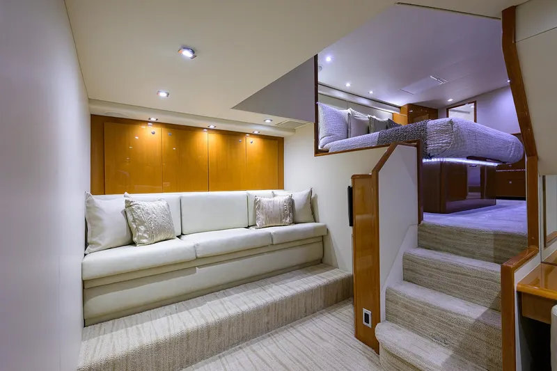 Slide: The Image of Luxurious interior of 2004 Viking 65 Enclosed Bridge yacht with elegant seating and stairs. - 34