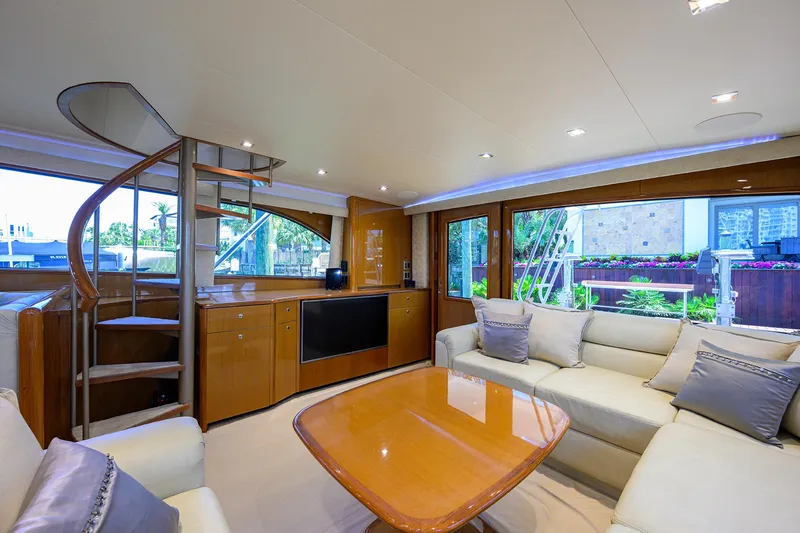 Slide: The Image of Luxurious interior of 2004 Viking 65 Enclosed Bridge yacht with modern furnishings. - 19