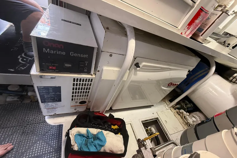Slide: The Image of Engine room of 2004 Viking 65 Enclosed Bridge with Onan Marine Genset. - 88