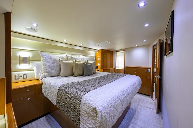 Slide: The Image of Luxurious bedroom interior of 2004 Viking 65 Enclosed Bridge w/Tower yacht. - 31