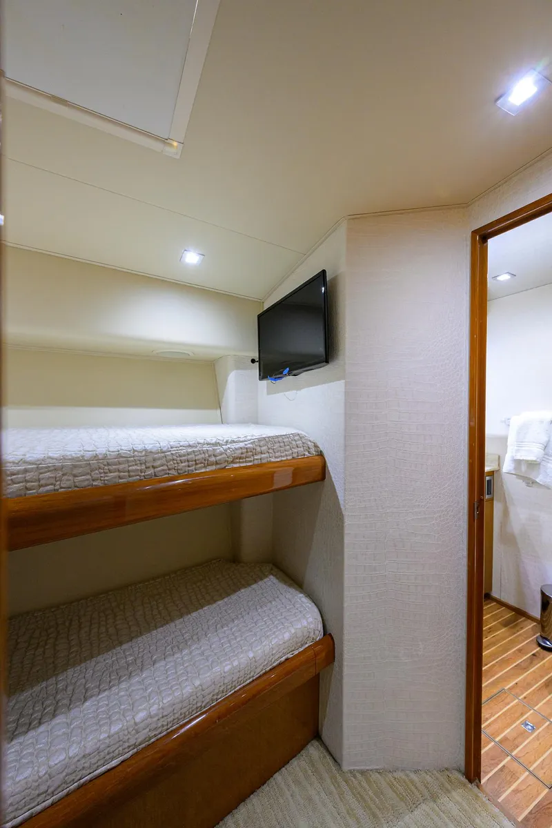 Slide: The Image of 2004 Viking 65 Enclosed Bridge w/Tower cabin with bunk beds and TV - 48