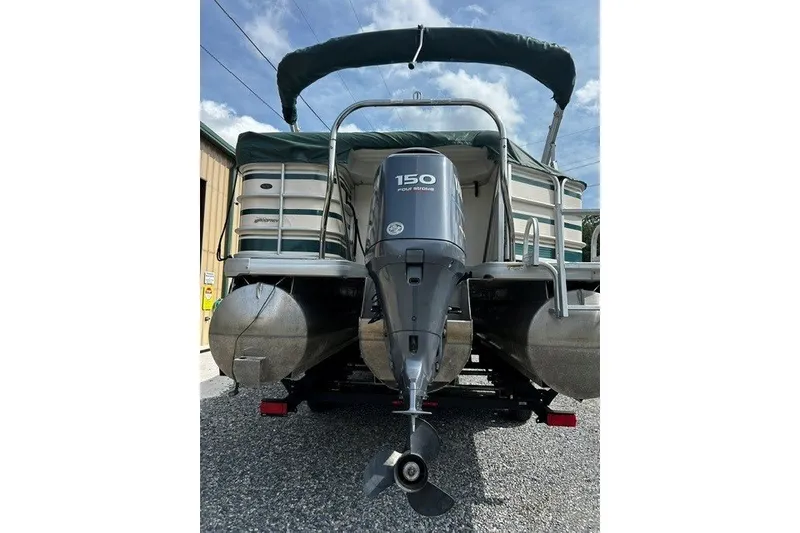 Slide: The Image of 2005 Godfrey SANPAN 2500 pontoon boat with 150 horsepower engine, rear view. - 18