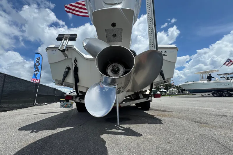 Slide: The Image of 2019 Blue Wave 2800 Pure Hybrid boat propeller, displayed outdoors under a cloudy sky. - 22