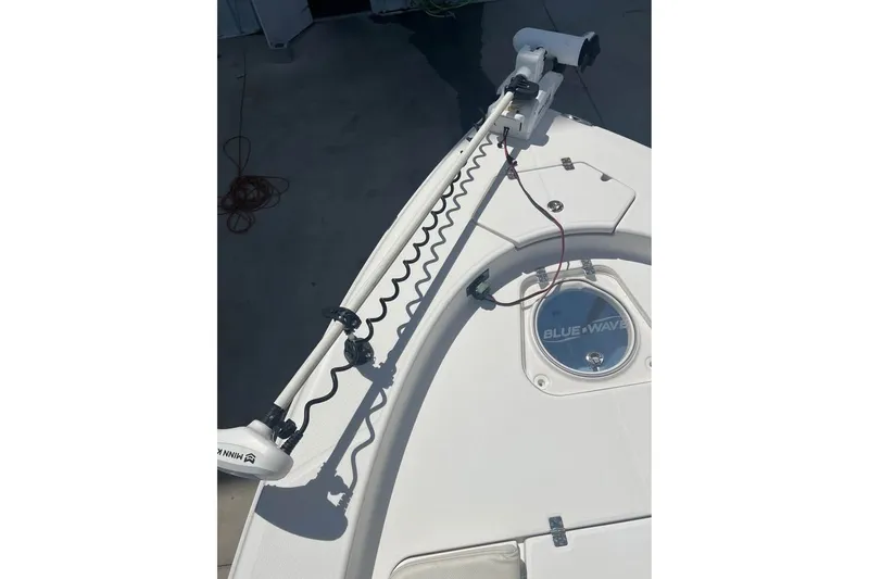 Slide: The Image of 2019 Blue Wave 2800 Pure Hybrid boat deck with trolling motor and hatch. - 7