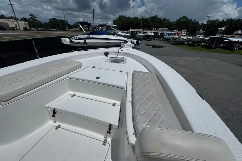 Slide: The Image of 2019 Blue Wave 2800 Pure Hybrid boat interior with cushioned seating and storage compartments. - 46