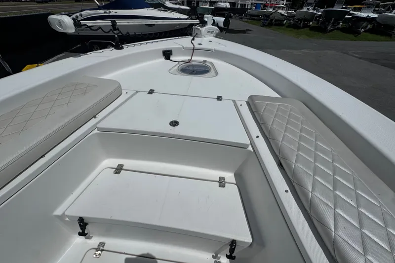 Slide: The Image of 2019 Blue Wave 2800 Pure Hybrid boat interior with cushioned seating and storage compartments. - 47
