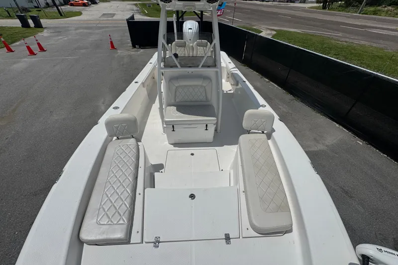 Slide: The Image of 2019 Blue Wave 2800 Pure Hybrid boat with white seating and spacious deck layout. - 56