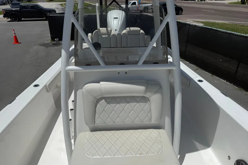 Slide: The Image of 2019 Blue Wave 2800 Pure Hybrid boat interior with white seating and console. - 61