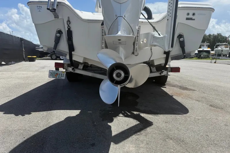 Slide: The Image of Rear view of a 2019 Blue Wave 2800 Pure Hybrid boat with visible propeller. - 23