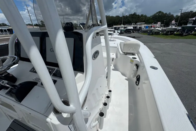 Slide: The Image of 2019 Blue Wave 2800 Pure Hybrid boat interior with steering console and seating. - 37