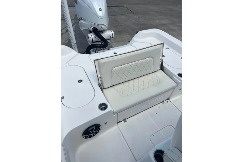 Slide: The Image of 2019 Blue Wave 2800 Pure Hybrid boat with cushioned seating and motor detail. - 8