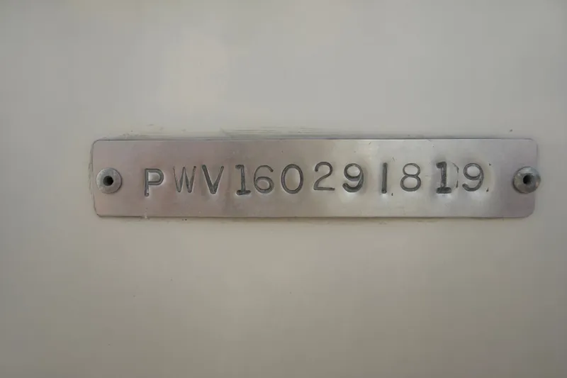 Slide: The Image of Metallic identification plate on a 2019 Blue Wave 2800 Pure Hybrid boat. - 74