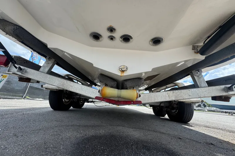 Slide: The Image of Underside view of a 2019 Blue Wave 2800 Pure Hybrid boat on a trailer. - 28