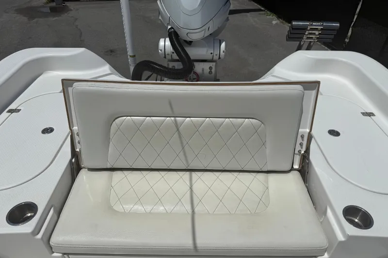 Slide: The Image of 2019 Blue Wave 2800 Pure Hybrid boat seat with diamond-stitched upholstery and cup holders. - 32