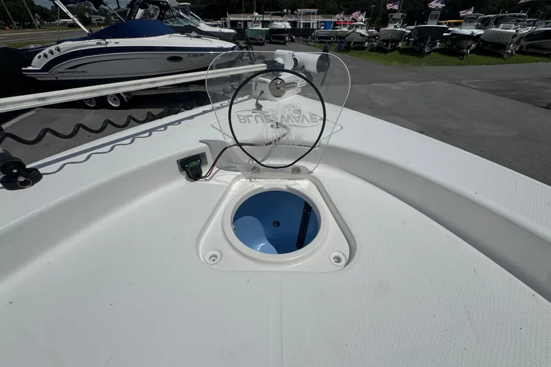 Slide: The Image of 2019 Blue Wave 2800 Pure Hybrid boat deck with open hatch, surrounded by other boats. - 50