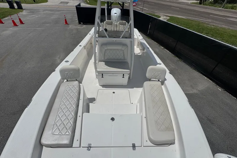 Slide: The Image of 2019 Blue Wave 2800 Pure Hybrid boat with white seating and spacious deck layout. - 40