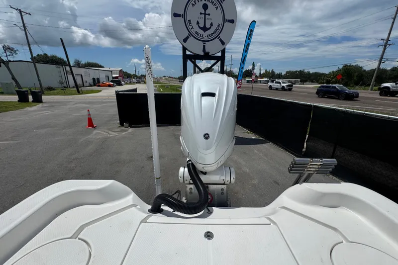 Slide: The Image of 2019 Blue Wave 2800 Pure Hybrid boat with outboard motor in a parking lot. - 29