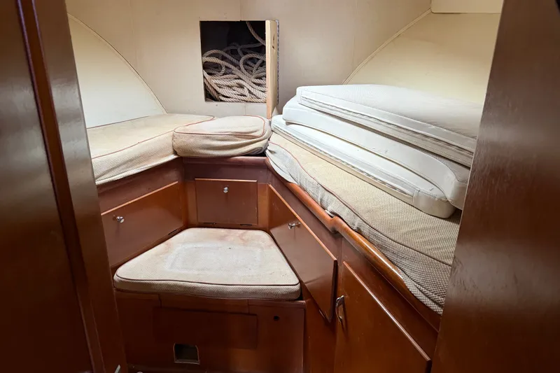 Slide: The Image of Interior cabin of a 1967 Hatteras 41 Convertible boat with cushions and storage. - 8