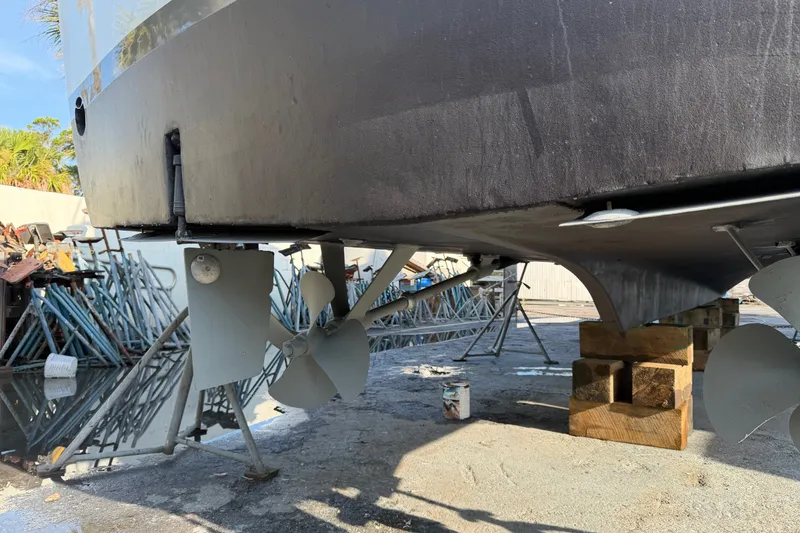 Slide: The Image of 1967 Hatteras 41 Convertible boat underside with propellers and rudders on dry dock. - 21