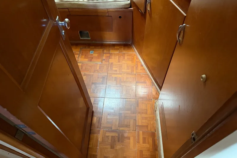 Slide: The Image of Interior of 1967 Hatteras 41 Convertible with wooden flooring and cabinetry. - 7