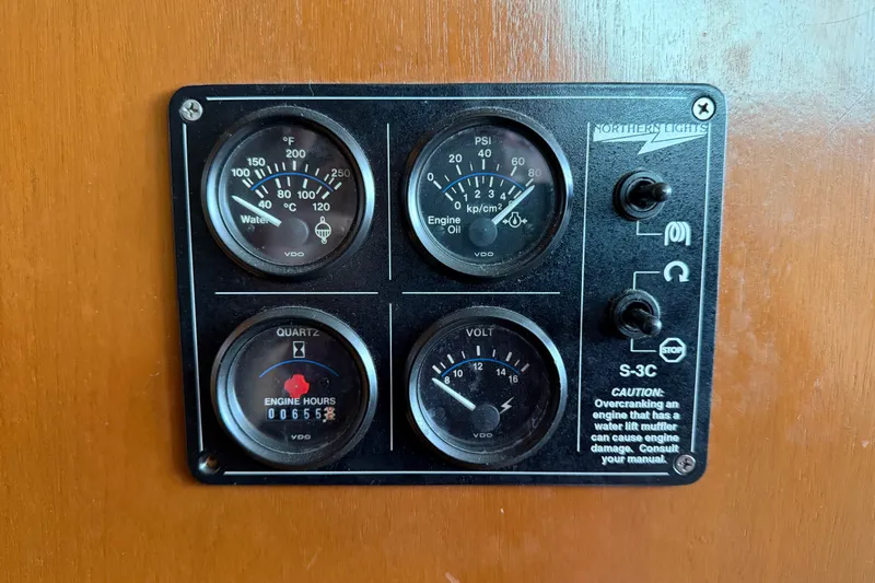 Slide: The Image of Instrument panel of a 1967 Hatteras 41 Convertible boat with gauges and switches. - 3