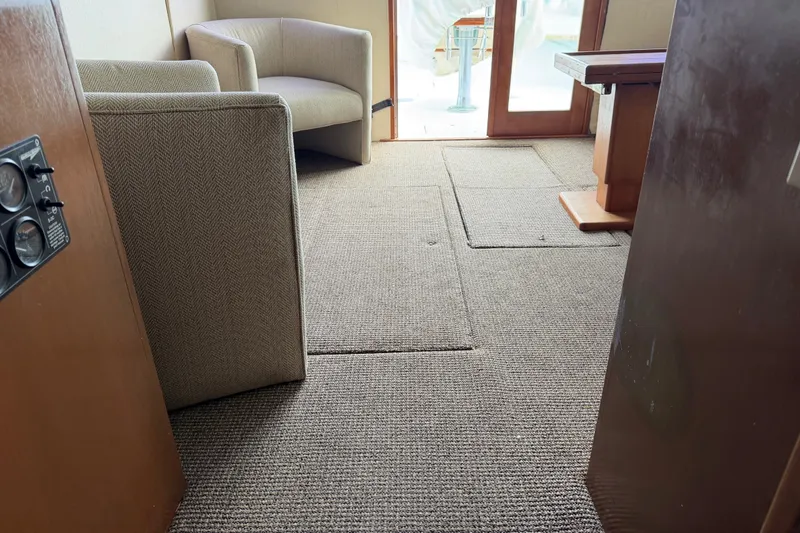 Slide: The Image of Interior of 1967 Hatteras 41 Convertible yacht with carpeted floor and seating area. - 15