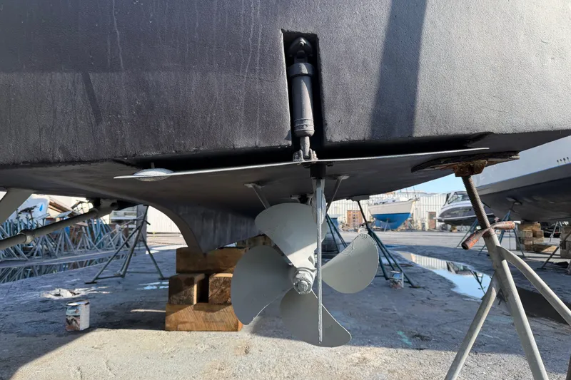 Slide: The Image of 1967 Hatteras 41 Convertible boat propeller and rudder in dry dock. - 20