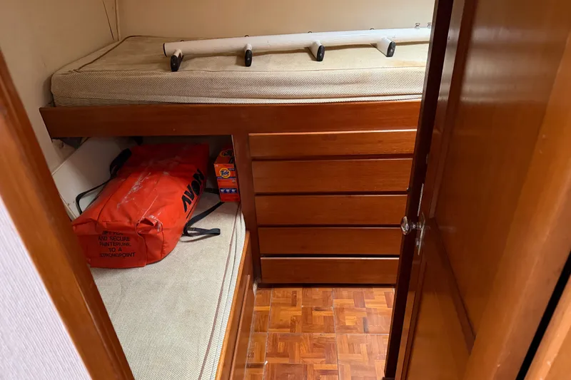 Slide: The Image of Interior cabin of 1967 Hatteras 41 Convertible with storage and wooden drawers. - 14