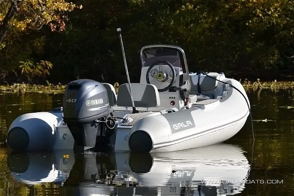 Slide: The Image of Gala Viking V360 boat with Yamaha 40HP engine on a calm lake, 2027 model. - 2