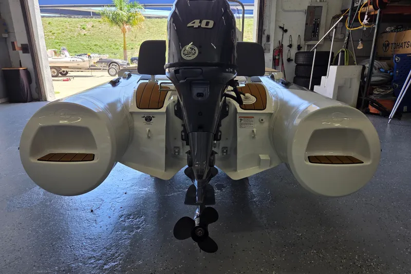 Slide: The Image of Gala Viking V360 2027 with Yamaha 40HP engine, parked in a workshop. - 5