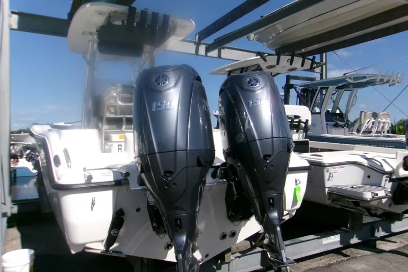 Slide: The Image of 2027 Key West 244 Center Console boat with dual 150 horsepower outboard engines. - 3