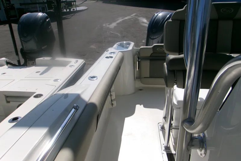 Slide: The Image of 2027 Key West 244 Center Console boat interior with seating and dual engines. - 20