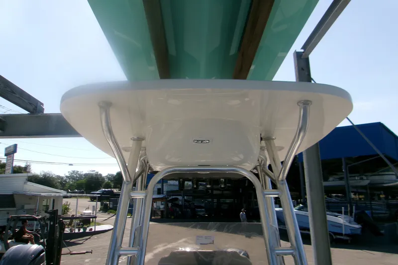 Slide: The Image of 2027 Key West 244 Center Console boat with T-top and stainless steel supports. - 17