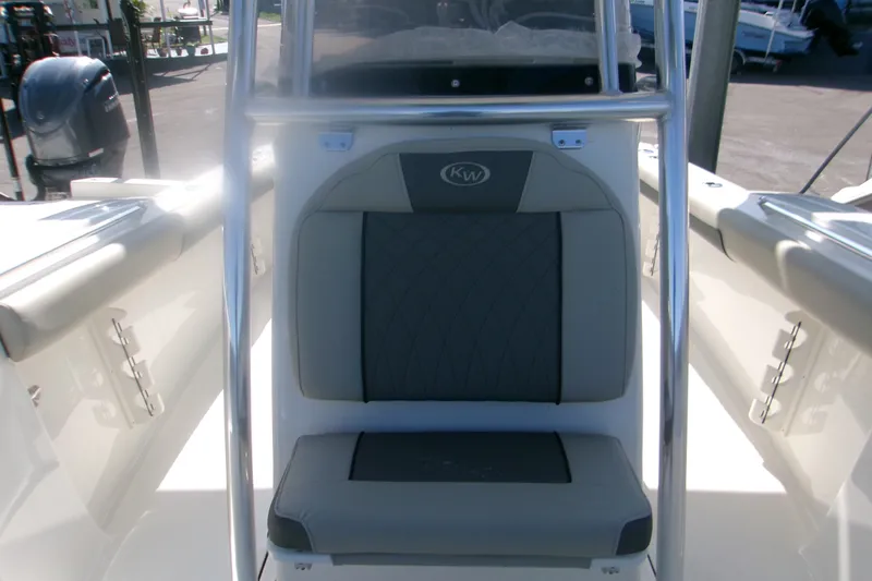Slide: The Image of 2027 Key West 244 Center Console boat interior with cushioned seating and stainless steel frame. - 16