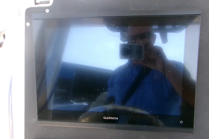 Slide: The Image of Reflection on Garmin screen in 2027 Key West 244 Center Console boat. - 13
