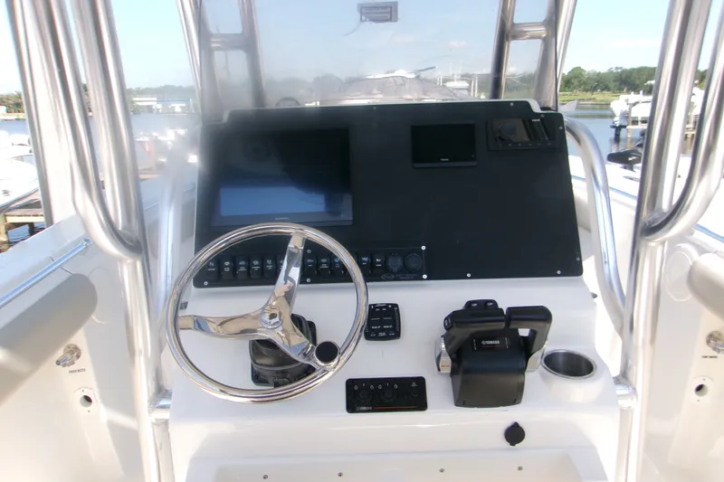 Slide: The Image of Center console of 2027 Key West 244 boat with steering wheel and controls. - 9