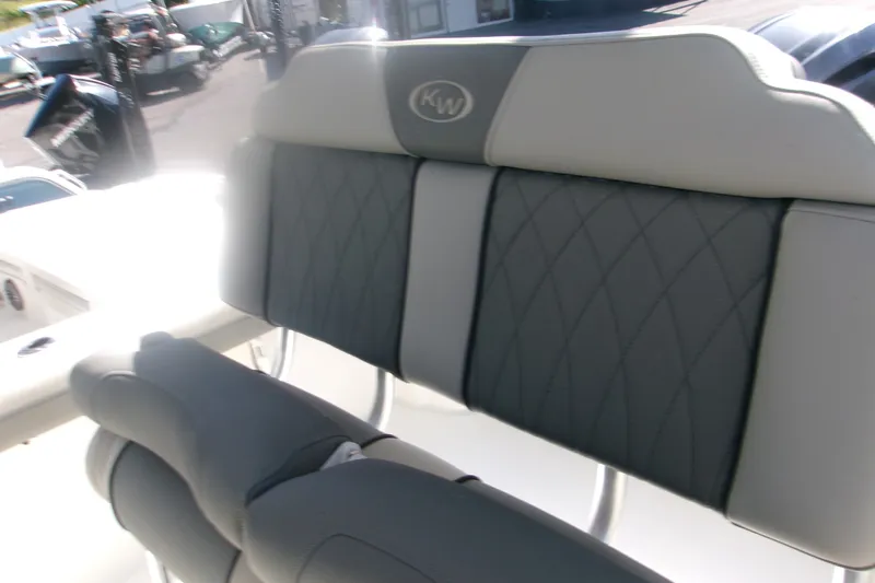 Slide: The Image of 2027 Key West 244 Center Console boat seat with diamond-pattern upholstery. - 10