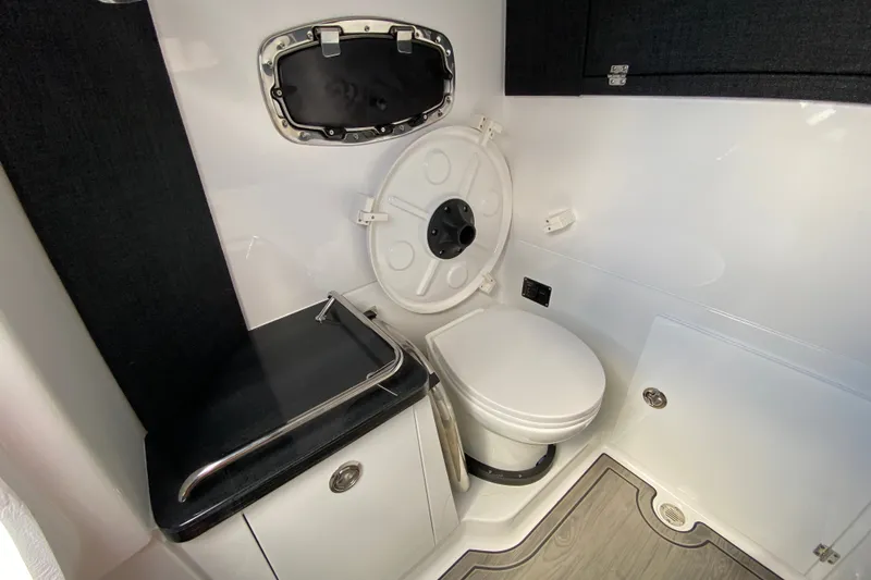Slide: The Image of Bathroom interior of 2027 Monterey Elite 30 OB boat, featuring modern fixtures and sleek design. - 27