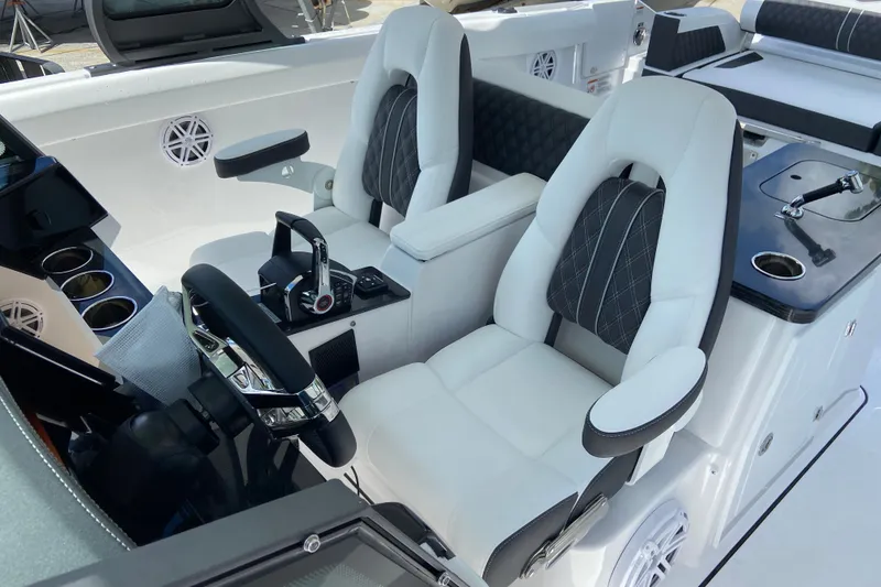 Slide: The Image of Luxurious interior of 2027 Monterey Elite 30 OB boat with plush seating and modern controls. - 17